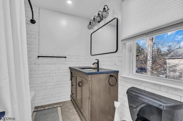 full bathroom with toilet, vanity, and shower / bath combination with curtain