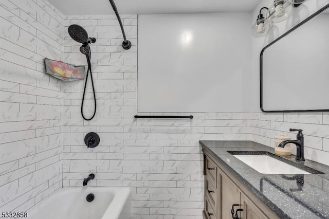 bathroom featuring vanity, tile walls, and tiled shower / bath