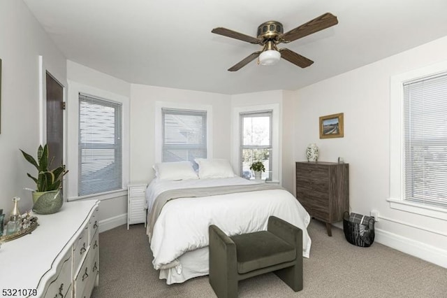 bedroom with ceiling fan and carpet floors