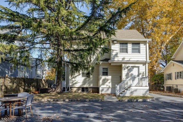 view of front of property featuring cooling unit