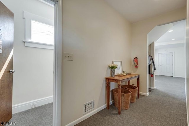 hallway with carpet