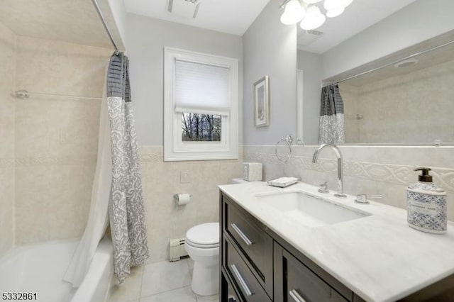 full bathroom with toilet, tile walls, baseboard heating, shower / bathtub combination with curtain, and vanity