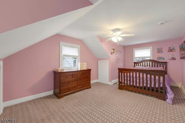 carpeted bedroom featuring lofted ceiling and ceiling fan