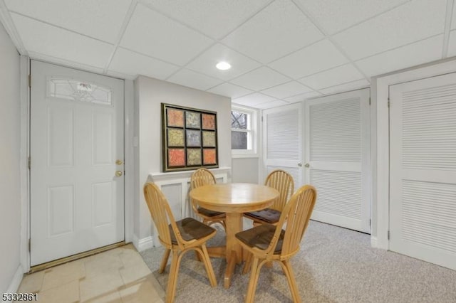 dining space featuring a paneled ceiling