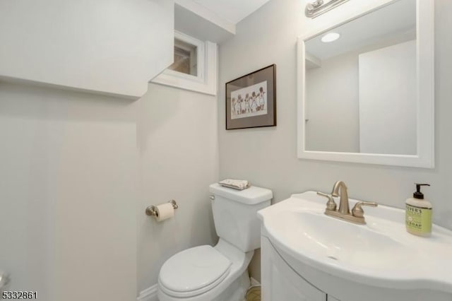 bathroom featuring toilet and sink