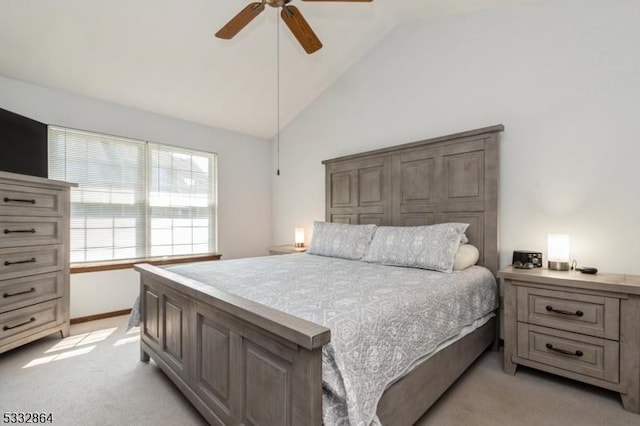 bedroom featuring ceiling fan, light colored carpet, and lofted ceiling