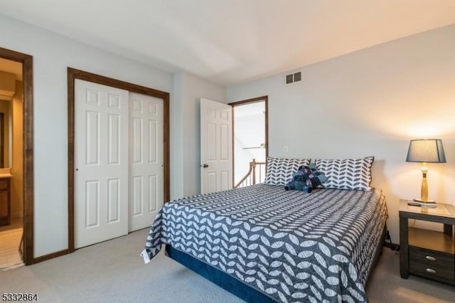 carpeted bedroom featuring a closet