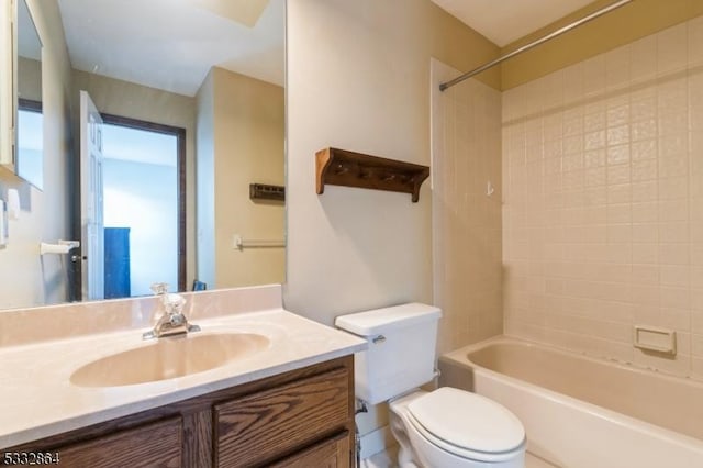 full bathroom featuring toilet, shower / bath combination, and vanity