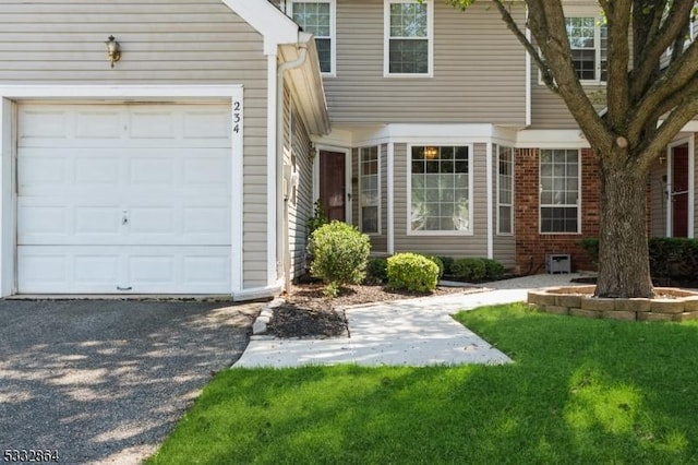 view of exterior entry with a garage