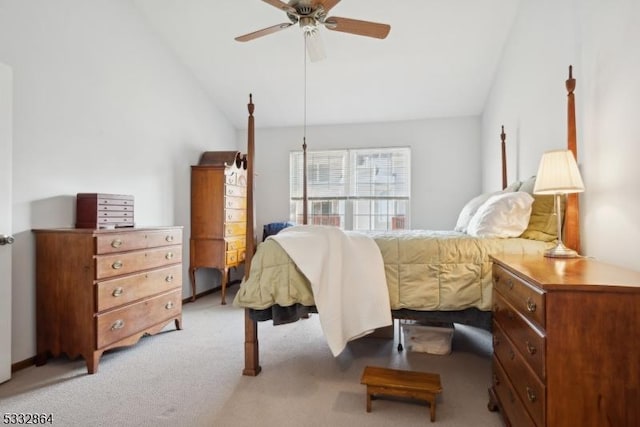 bedroom with vaulted ceiling, ceiling fan, and light colored carpet