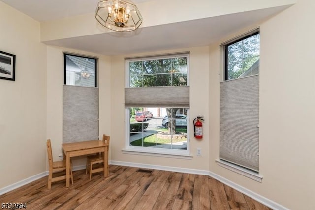 interior space featuring a chandelier and hardwood / wood-style floors