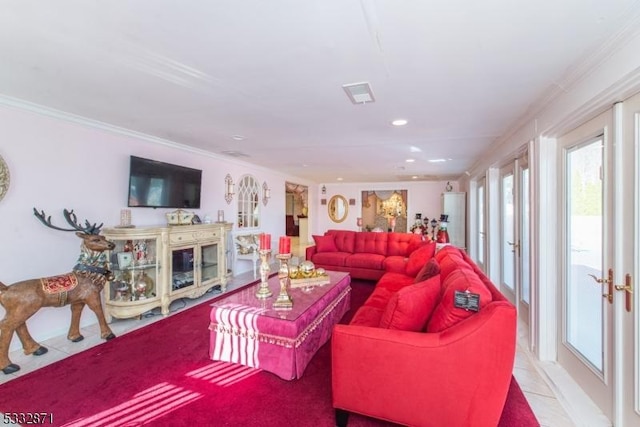 tiled living room with french doors and crown molding