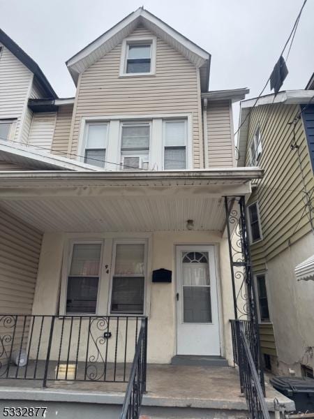 property entrance with covered porch