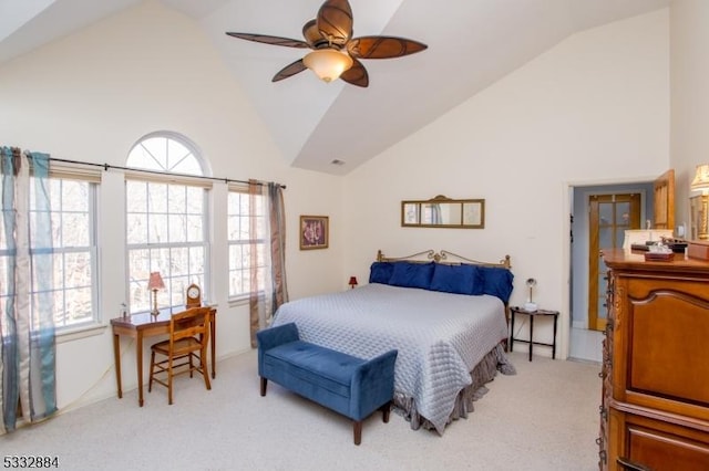 bedroom with ceiling fan, light carpet, and high vaulted ceiling