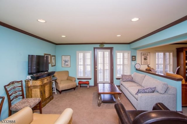 carpeted living room with ornamental molding