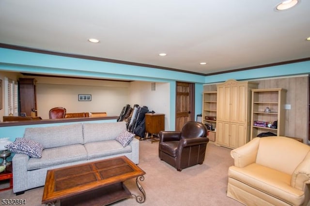 carpeted living room featuring crown molding