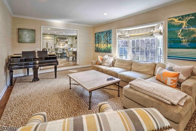 living room featuring hardwood / wood-style flooring and ornamental molding