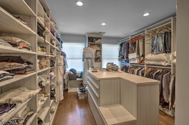 spacious closet with dark hardwood / wood-style floors