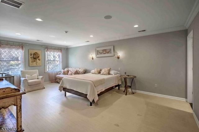 bedroom with ornamental molding and light hardwood / wood-style flooring