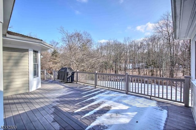 wooden deck featuring grilling area