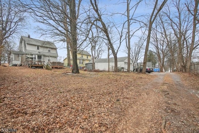 view of yard featuring a wooden deck