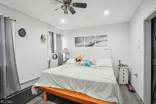 bedroom featuring ceiling fan and hardwood / wood-style floors