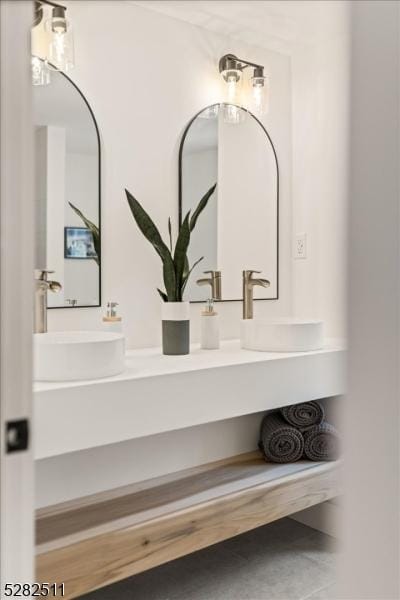 bathroom with tile patterned flooring and vanity