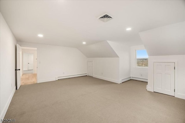 bonus room featuring a baseboard radiator, light colored carpet, and vaulted ceiling