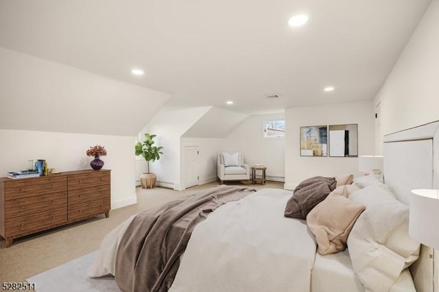 bedroom featuring light colored carpet and lofted ceiling