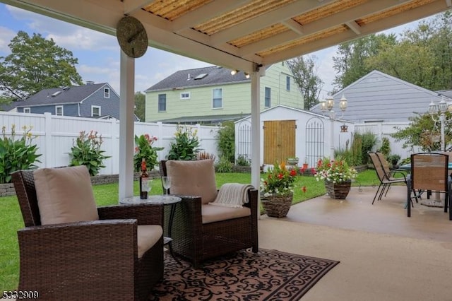 view of patio featuring a shed