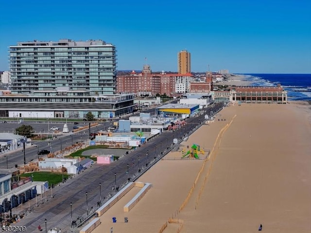 exterior space featuring a water view and a view of the beach