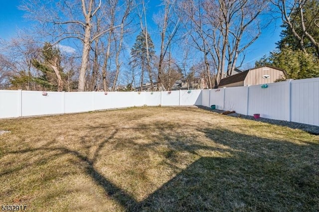 view of yard with a fenced backyard