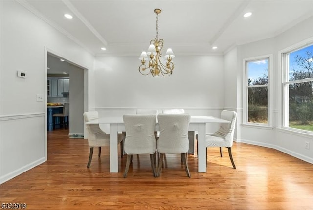 dining area featuring a chandelier, plenty of natural light, and light hardwood / wood-style flooring