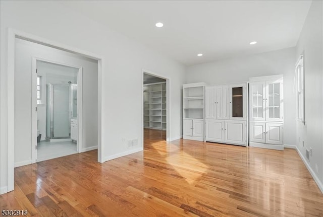 unfurnished bedroom with light wood-type flooring