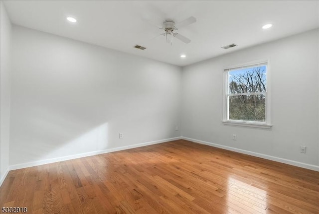 unfurnished room with ceiling fan and light hardwood / wood-style floors