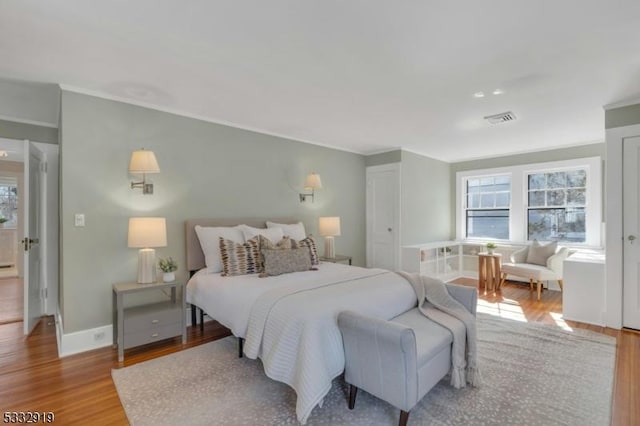 bedroom with light hardwood / wood-style flooring