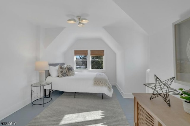 bedroom featuring lofted ceiling