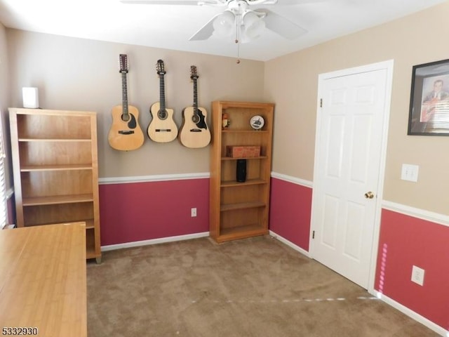 interior space with baseboards and ceiling fan