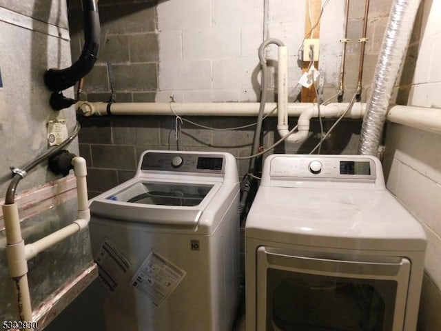 laundry area featuring washing machine and dryer and laundry area