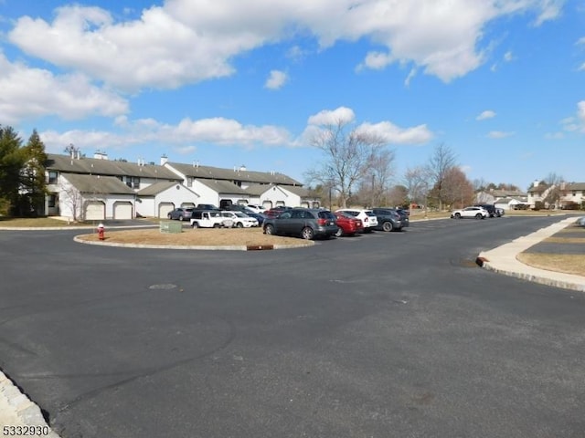 view of road featuring curbs and a residential view