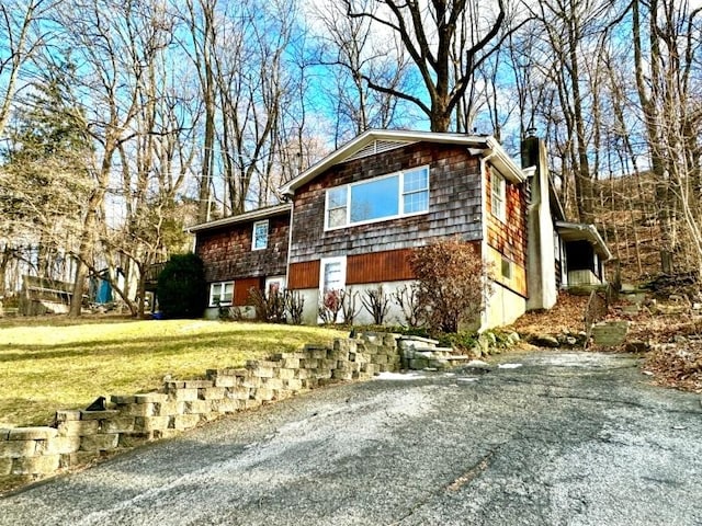 view of front of home with a front yard