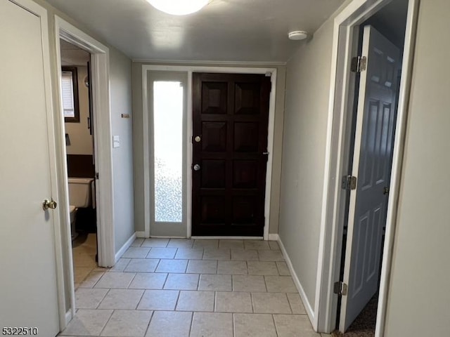 entrance foyer featuring light tile patterned floors