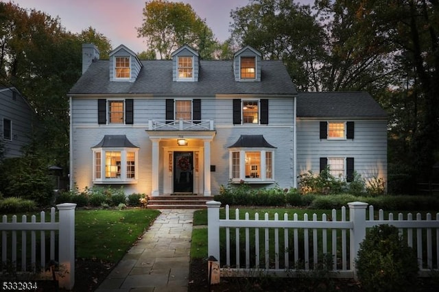 view of front of property with a yard