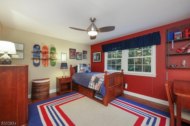 bedroom featuring ceiling fan and dark hardwood / wood-style floors