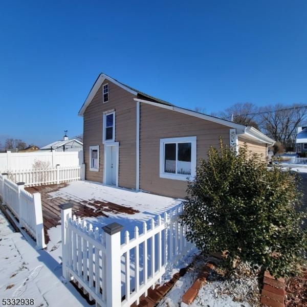 1041 County Road 519, Kingwood Twp, NJ 08825 - view of snowy exterior with fence