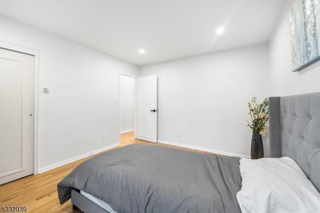 bedroom with wood-type flooring