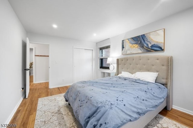 bedroom featuring a closet and hardwood / wood-style floors