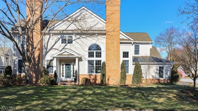 view of front of home with a front yard