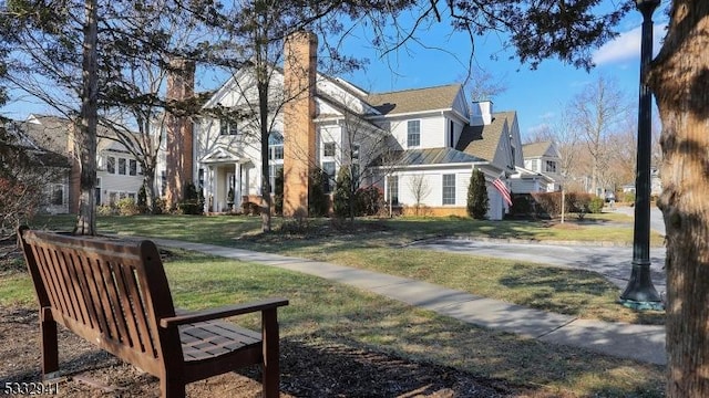 view of community featuring a lawn