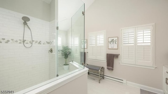 bathroom with a wealth of natural light and tiled shower